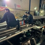 Workers making aluminized tubes